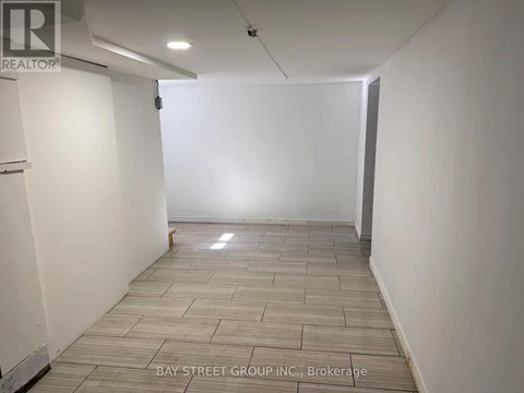 A room with a tiled floor and white walls.
