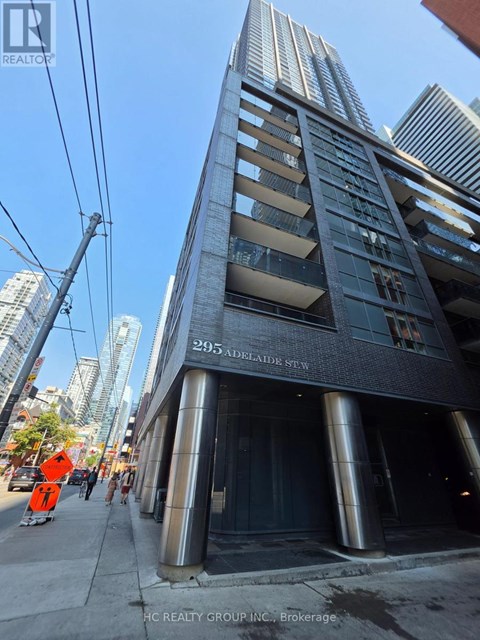 A tall building with a sign that reads "295 Adelaide St W" is shown in the image.