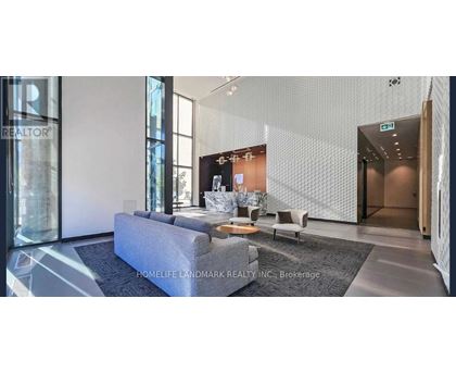 A modern living room with a grey sofa and a coffee table.