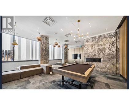 A room with a pool table and a sign that says REALTOR.