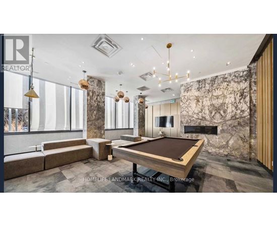 A room with a pool table and a sign that says REALTOR.