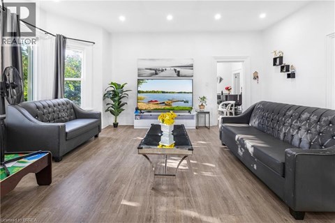 A living room with a grey sofa and a coffee table.