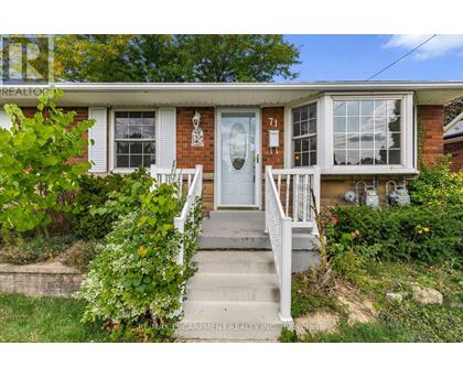 A house with the number 71 on the front door.