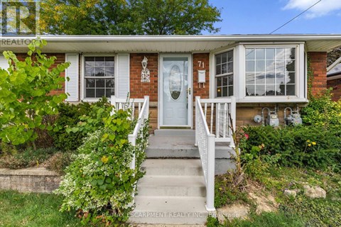 A house with the number 71 on the front door.