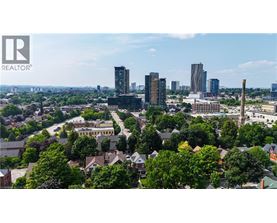 A cityscape with a mix of residential and commercial buildings.
