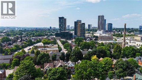 A cityscape with a mix of residential and commercial buildings.