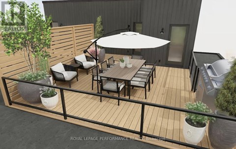 A patio with a table and chairs and a white umbrella.