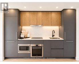 A modern kitchen with wooden cabinets and stainless steel appliances.