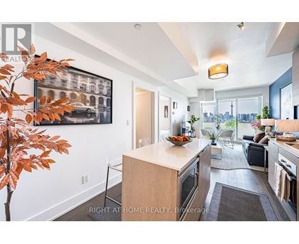 A modern kitchen with a dining table and chairs.