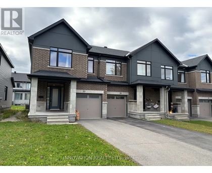 A modern two-story house with a garage is for sale.