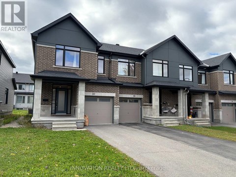 A modern two-story house with a garage is for sale.
