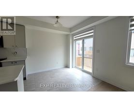 A room with a sliding glass door leading to a balcony.