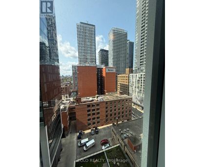 A view of a cityscape from a high-rise building with a sign that reads "ZOLO REALTY, Brokerage".