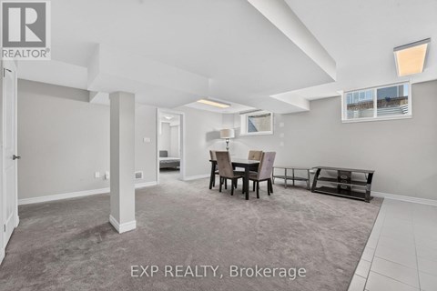A living room with a dining table and chairs.
