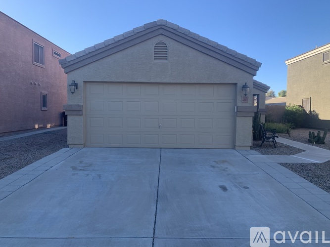 A house with a garage is available for sale.