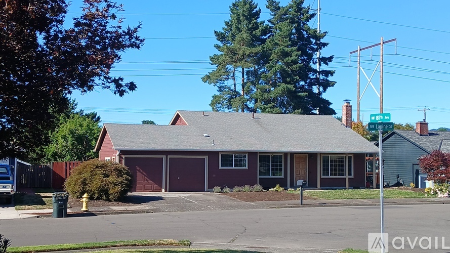 A house with a red roof and a sign that says "available" in front of it.