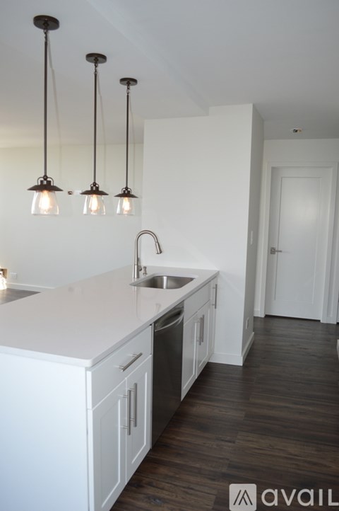 A kitchen with a sink and a counter.