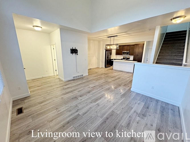 A living room with a view to the kitchen.