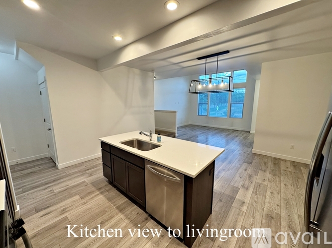 A kitchen with a view to the living room.