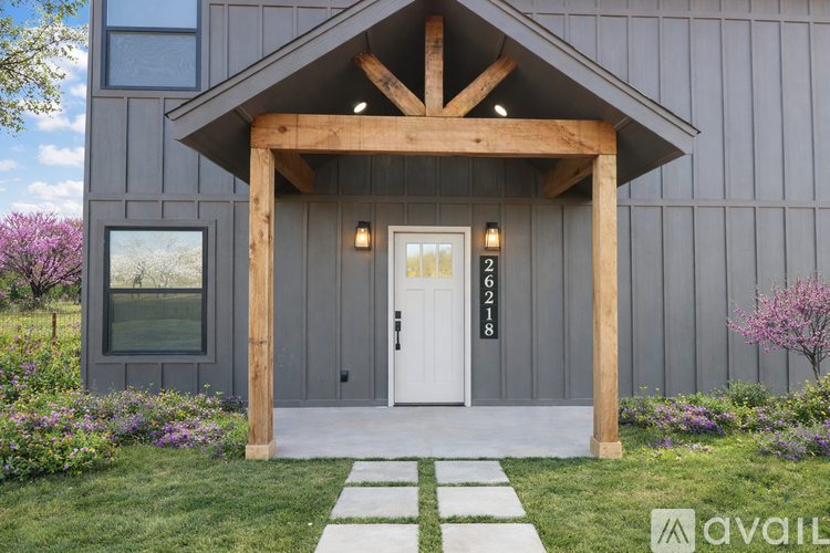 A house with a white door and a wooden porch.