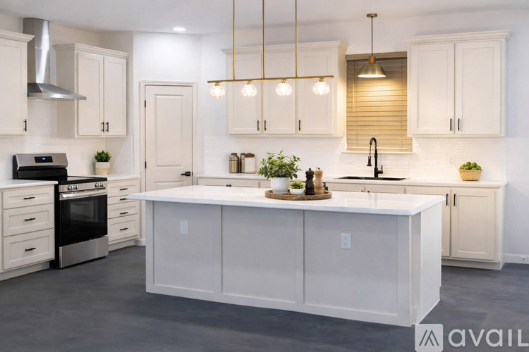 A modern kitchen with white cabinets and a central island.