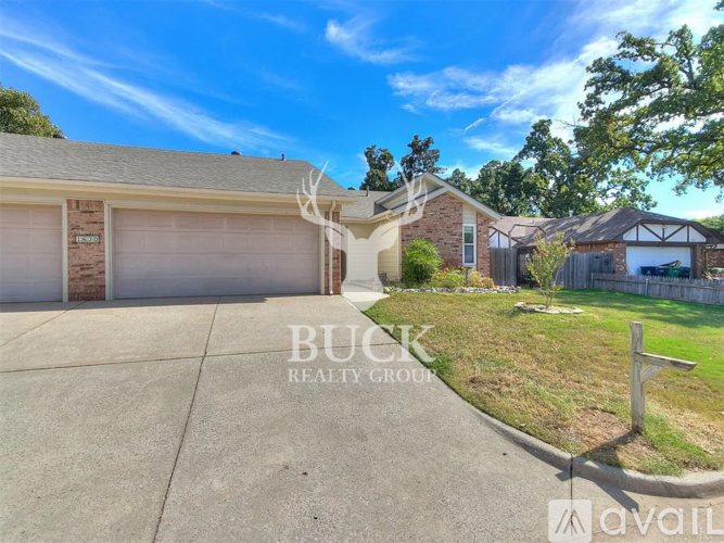 A house with a garage is for sale.