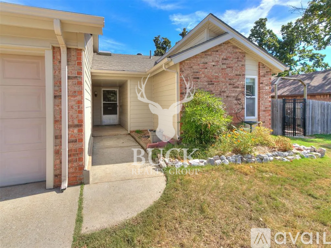 A house with a garage is for sale.