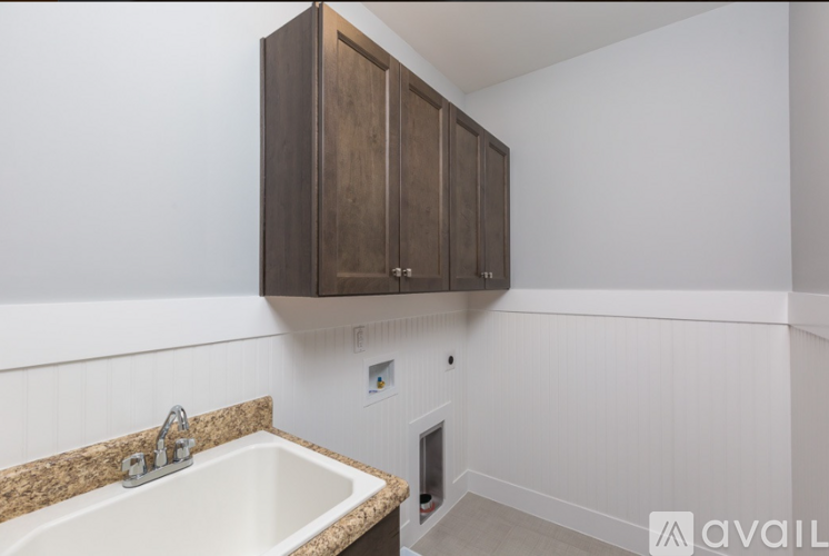 A kitchen with a sink and cabinets.