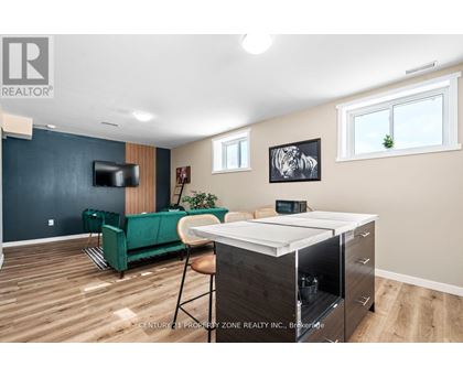 A living room with a green sofa and a television.