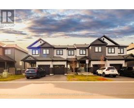 A modern house with a blue window is for sale by Royal LePage Integrity Realty Brokerage.