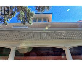 A building with a white roof and columns.