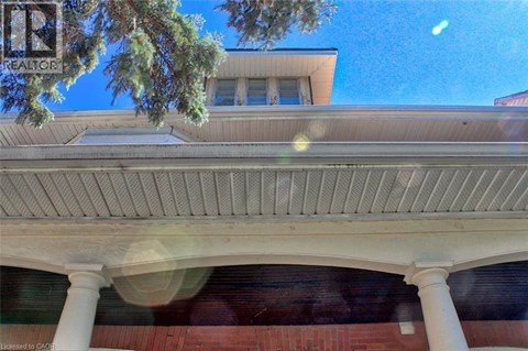 A building with a white roof and columns.