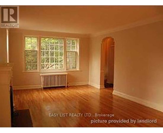 A room with a window and a radiator is for sale.