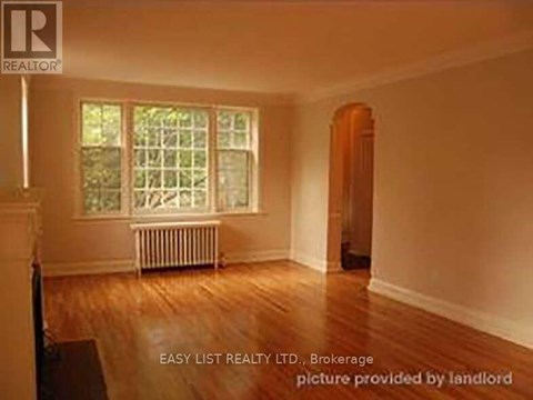 A room with a window and a radiator is for sale.