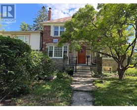 A house with a red roof and a sign that says "Easy List Realty LTD, Brokerage".