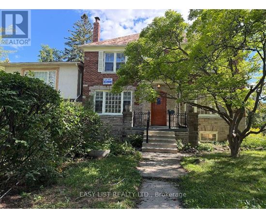 A house with a red roof and a sign that says "Easy List Realty LTD, Brokerage".