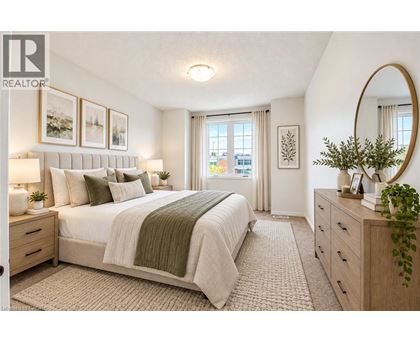 A bedroom with a large bed, a mirror, and a window with curtains.