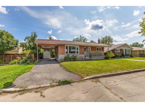 A house with a driveway in front of it.