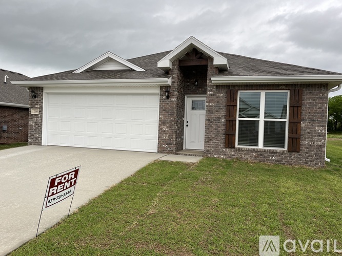 A house with a "For Rent" sign in front.