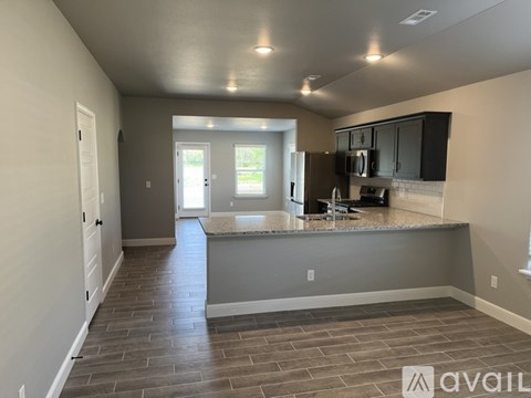 A kitchen with a countertop and cabinets is shown in this image.