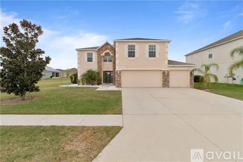 A house with a driveway in front of it.