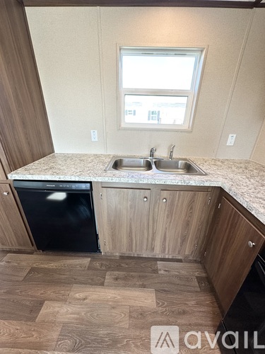 A kitchen with a sink and a dishwasher.