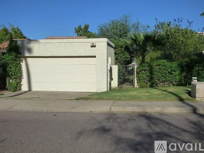 A house with a garage and a driveway.