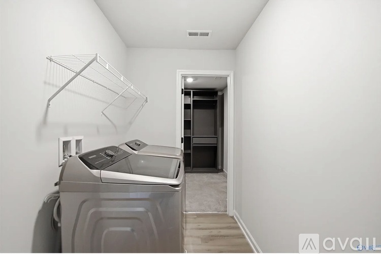 A laundry room with a washer and dryer.