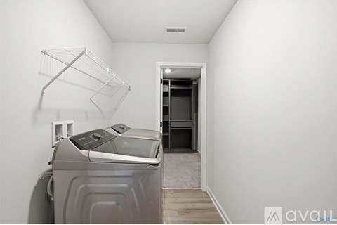 A laundry room with a washer and dryer.