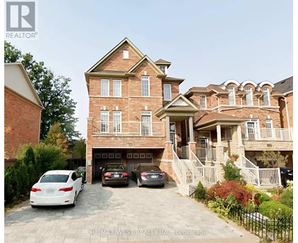A large brick house with a carport and a white car parked in front.