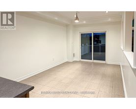 A spacious room with a sliding glass door and a tiled floor.