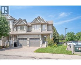 A large, well-maintained house with a driveway and garage.