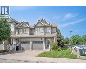 A large, well-maintained house with a driveway and garage.