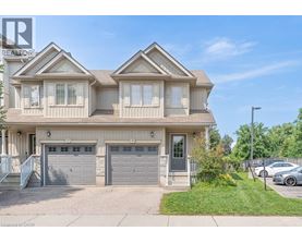 A two-story house with a garage is for sale.